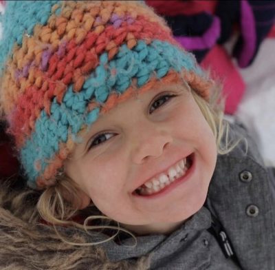 Young child smiling at camera