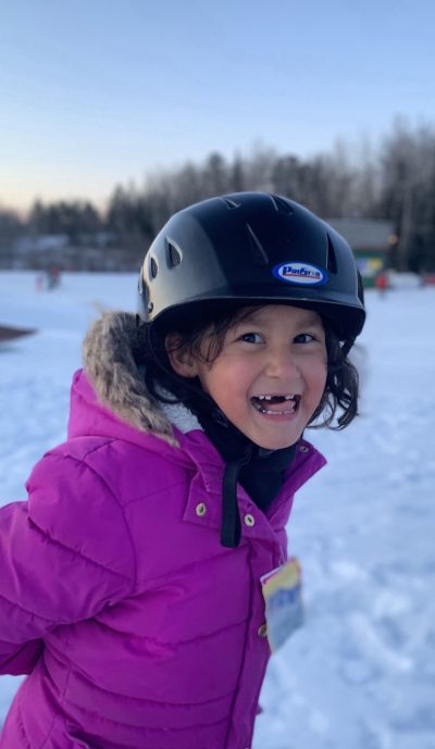 Young child smiling at the camera