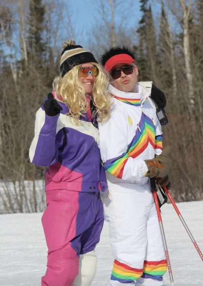 Skiers in costumes posing for the camera